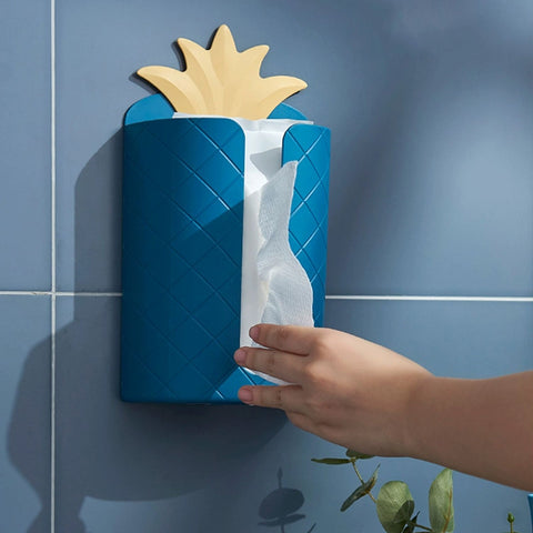 Wall-mounted napkin dispenser in the shape of a pineapple