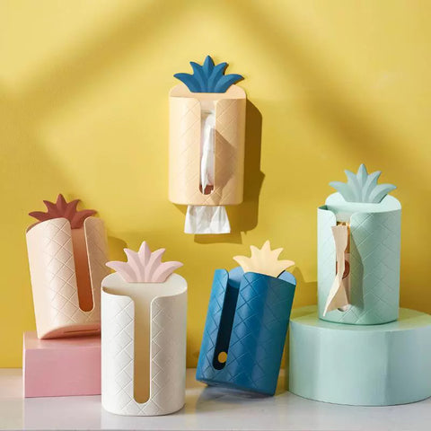 Wall-mounted napkin dispenser in the shape of a pineapple
