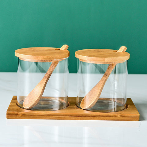 Set of glass spice jars with wooden lids