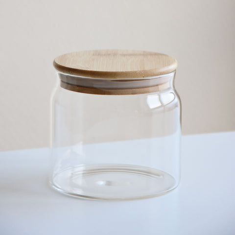 A glass jar with a bamboo lid