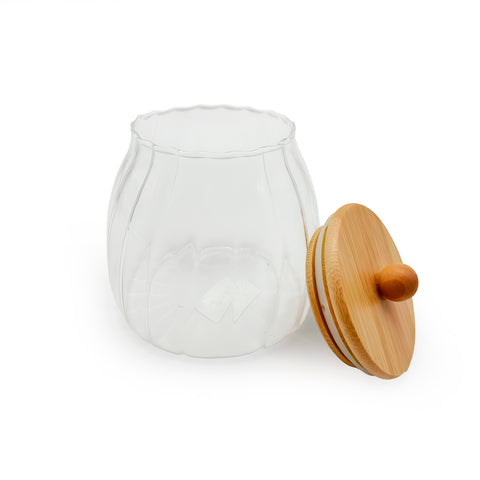 An elegant glass jar with a bamboo lid