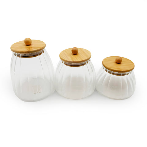 An elegant glass jar with a bamboo lid