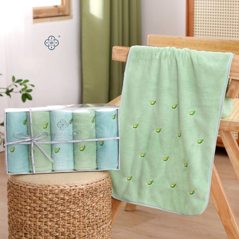 A set of towels with a delicate avocado design for freshness in your home