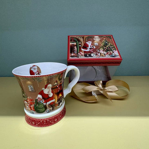 Christmas cup with Santa in a gift box