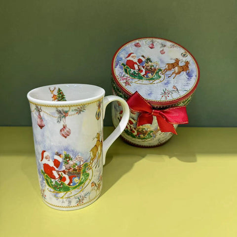 Christmas cup with Santa in a gift box