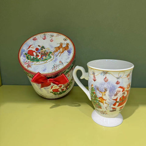 New Year's cup with Santa in a gift box