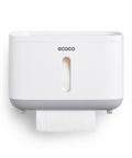 Настінний тримач Ecoco з рулоном туалетного паперу, край полотна виходить крізь нижню щілину корпусу