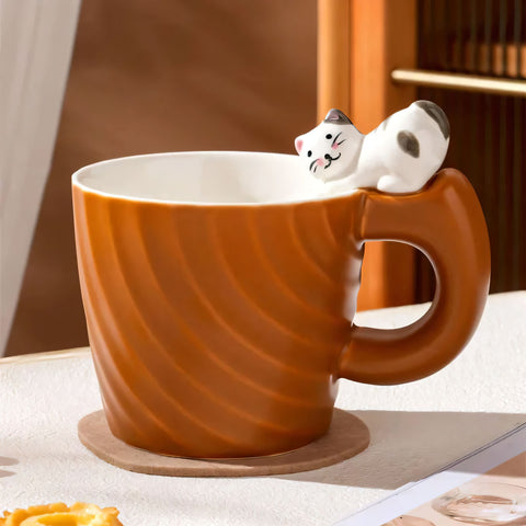 Ceramic mug with a figurine of a cat