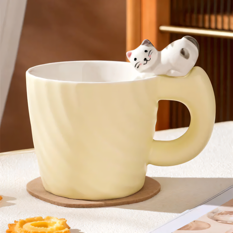 Ceramic mug with a figurine of a cat