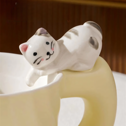 Ceramic mug with a figurine of a cat