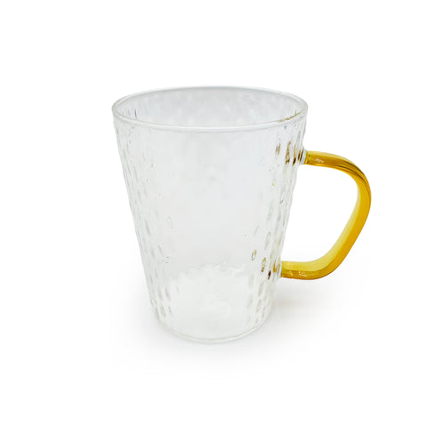 Elegant glass mug with a yellow handle