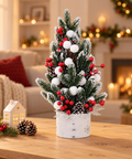 Ялинка «Snow Pine» на столі у новорічній вітальні
