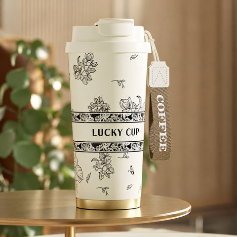 Тамблер «Lucky Cup» молочний із чорно-білим квітковим малюнком і ремінцем COFFEE